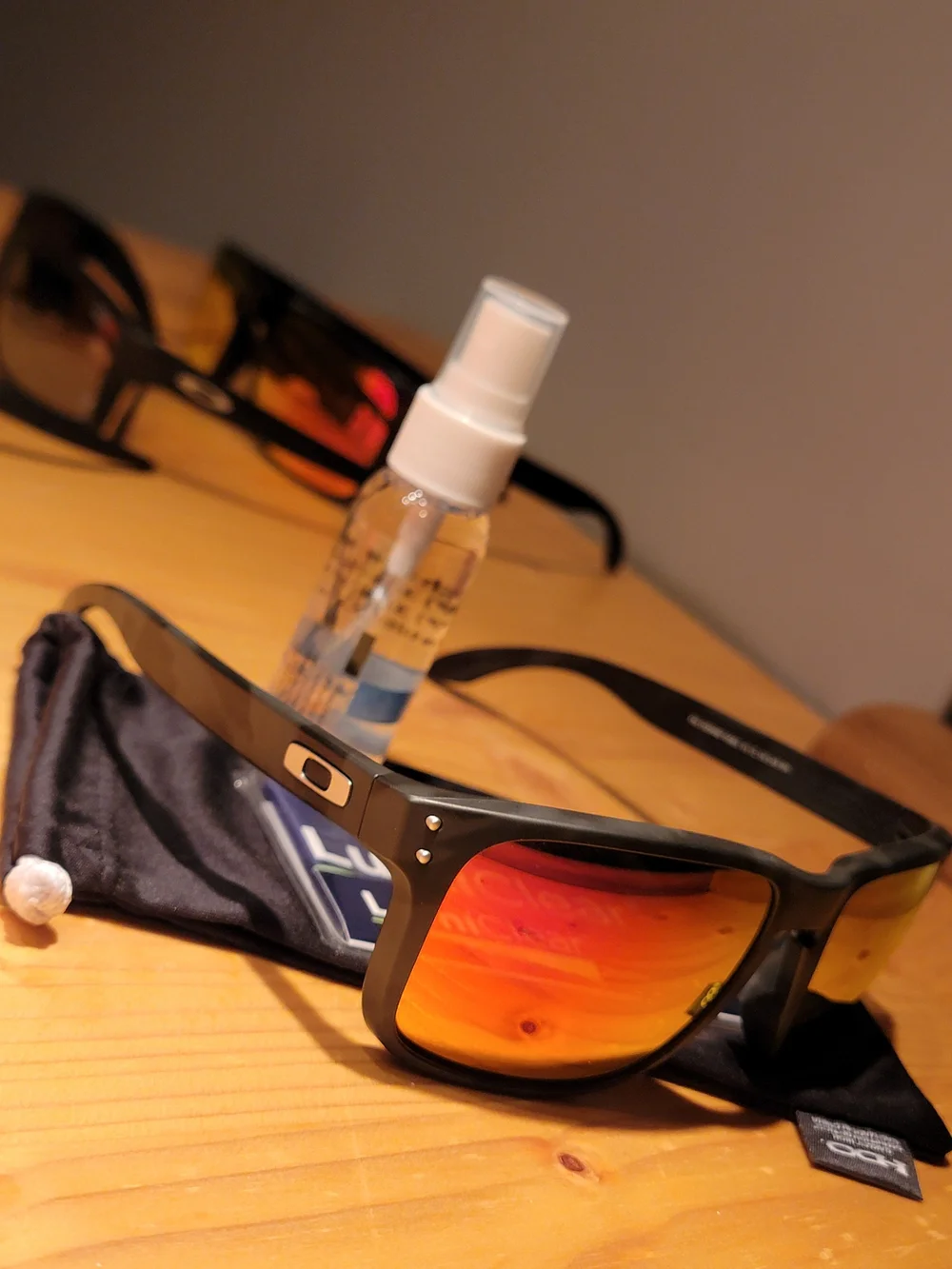 Oakley Men’s Black Frame Sunglasses with Red Orange Mirror Lenses